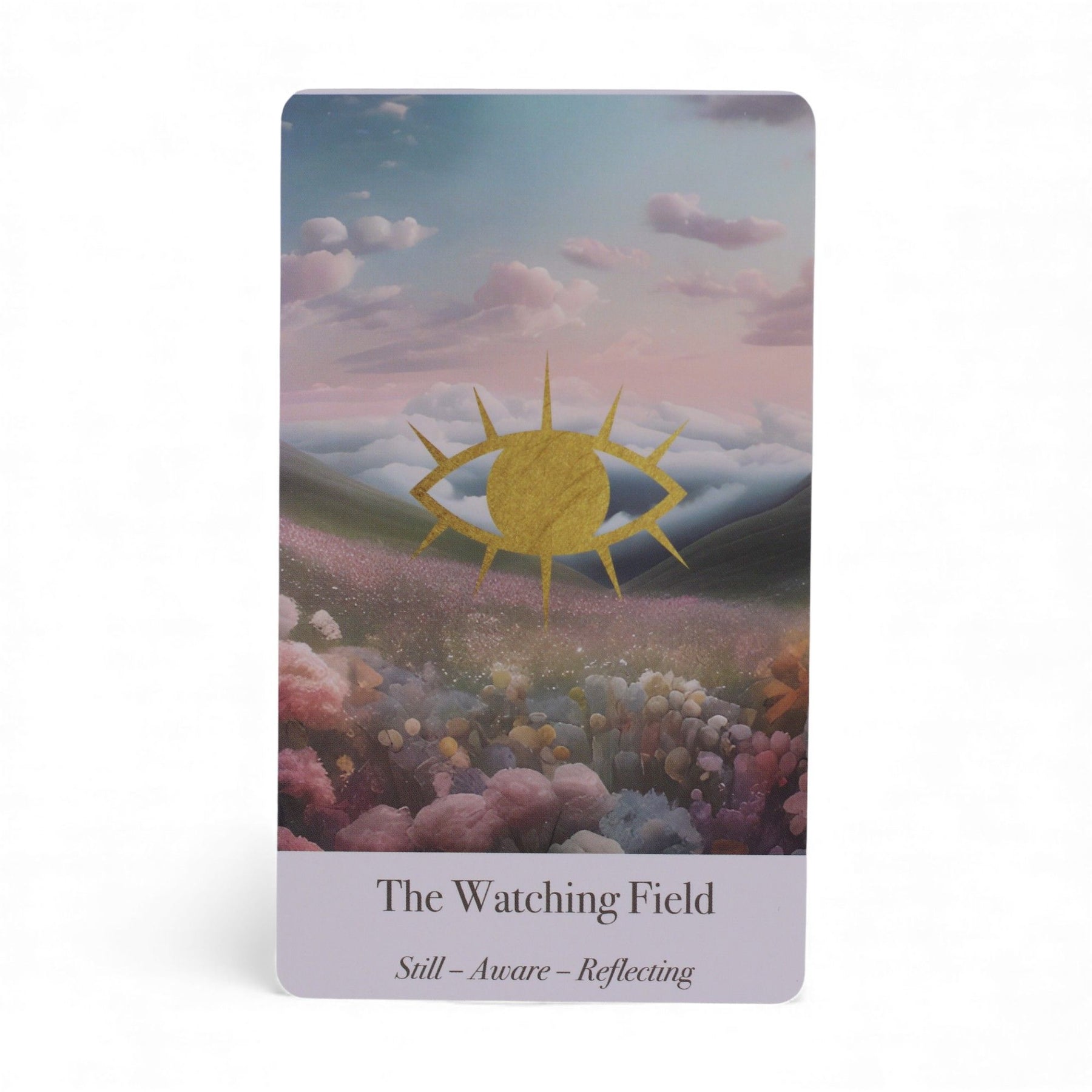 Card with a stylized sun over a field of flowers and clouds, titled 'The Watching Field'.