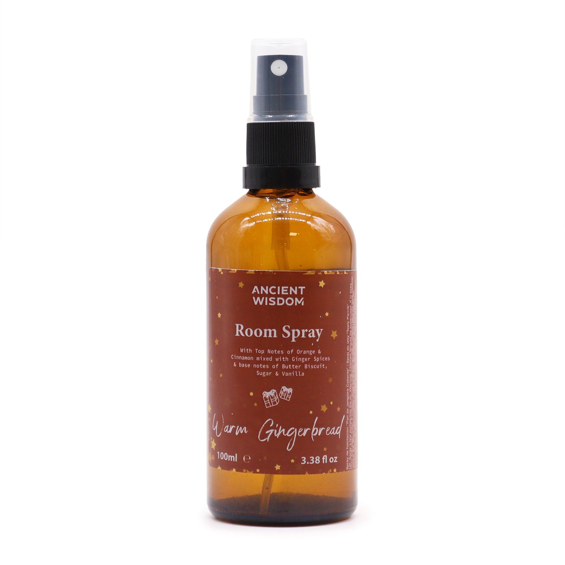 100ml Warm Gingerbread room spray bottle with gingerbread men, cinnamon sticks and orange slices on cosy Christmas kitchen background