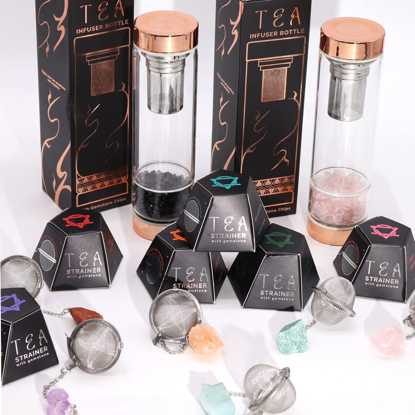 Tea infuser bottles and strainers with packaging on a white background