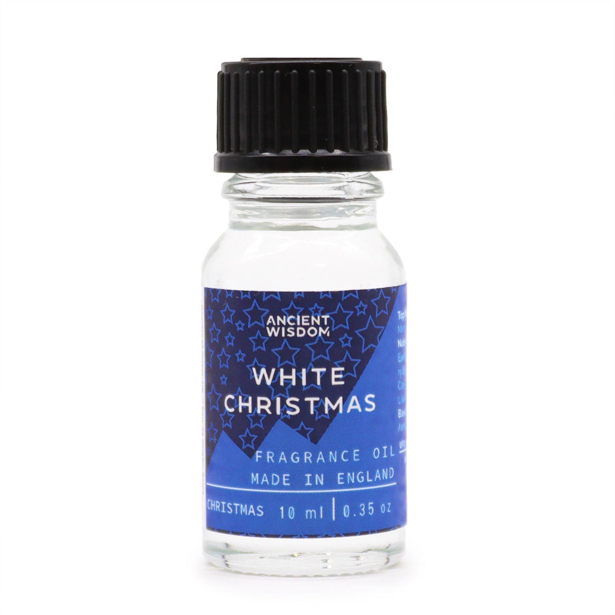 10ml White Christmas fragrance oil bottle surrounded by frosted pine, snowflakes and glittering snow on dark winter background