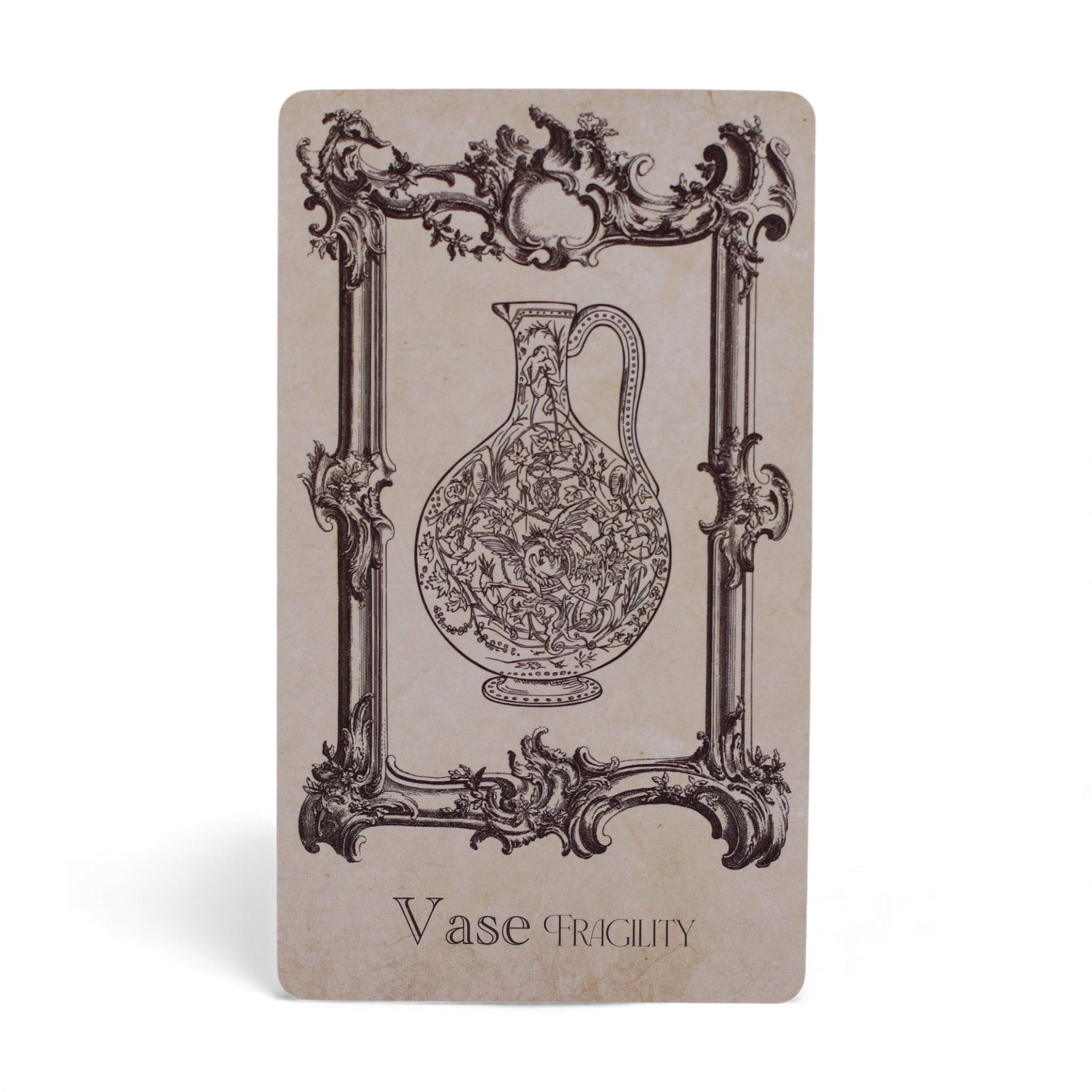 40-card Spellbook Oracle Deck fanned out showing monochrome sigils, creatures & artefacts, in illustrated compact box