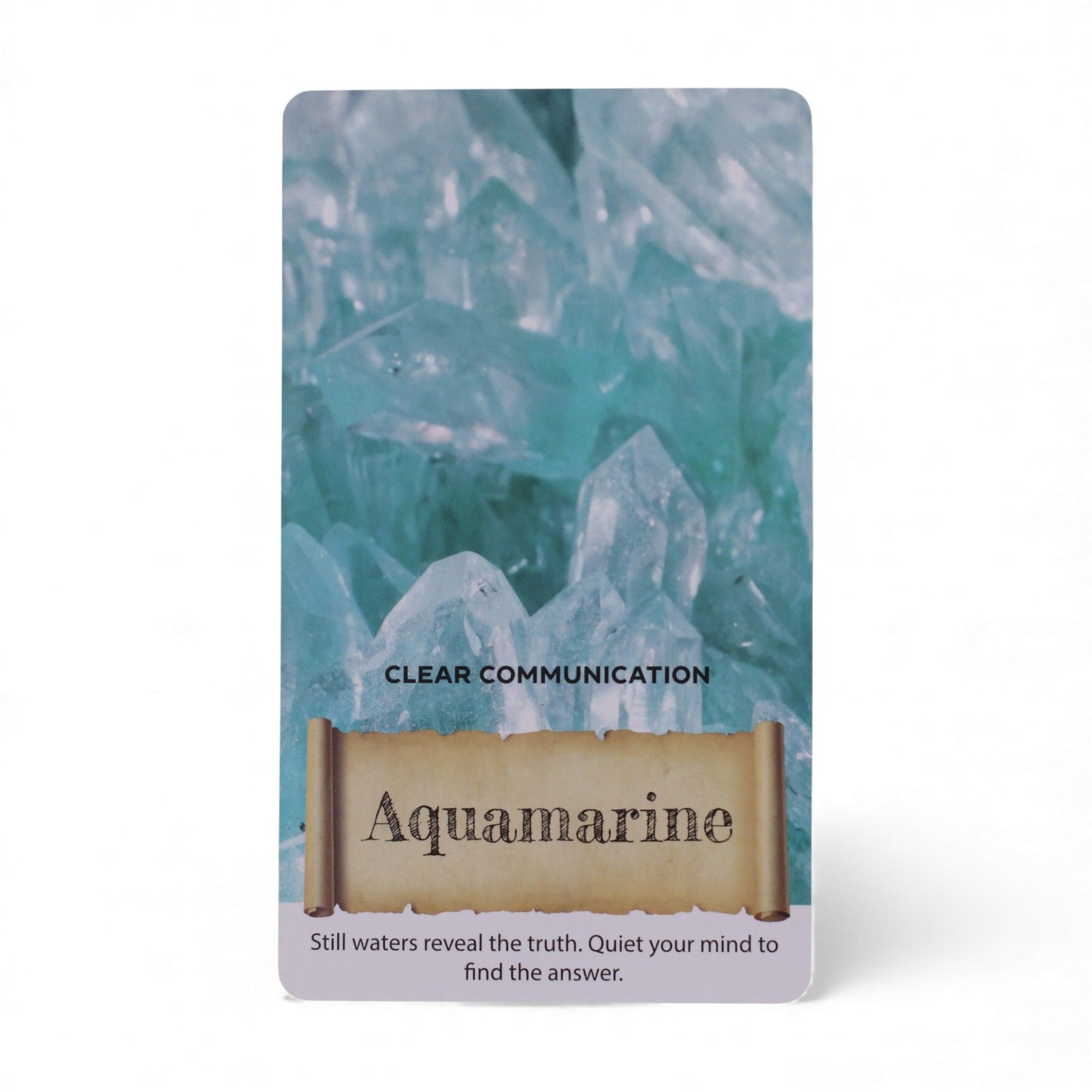 Card with aquamarine crystal design and text about clear communication and still waters revealing truth.