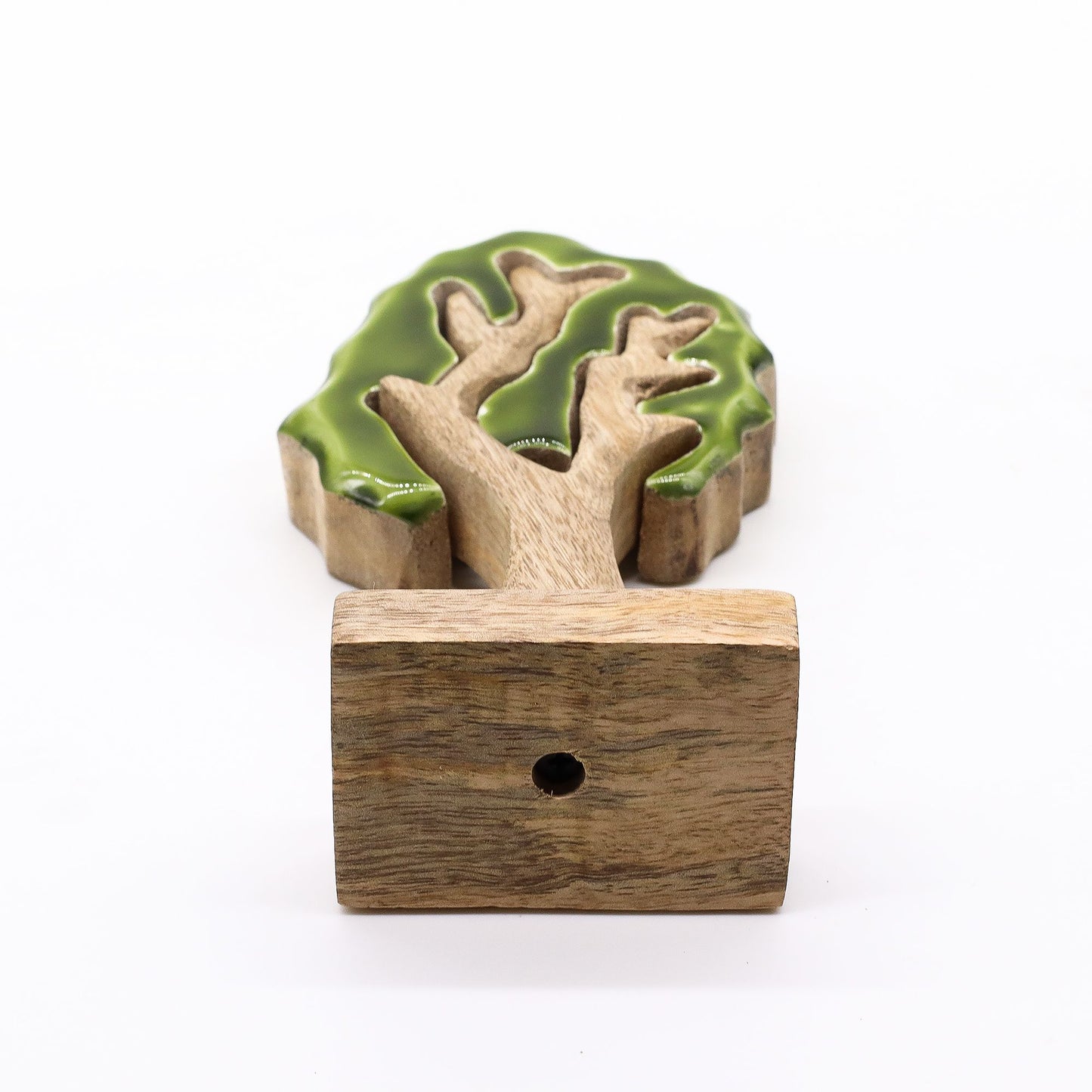 20 cm tall 3D mango wood Christmas tree with deep green enamel branches on wooden base, styled on shelf with fairy lights and pine cones