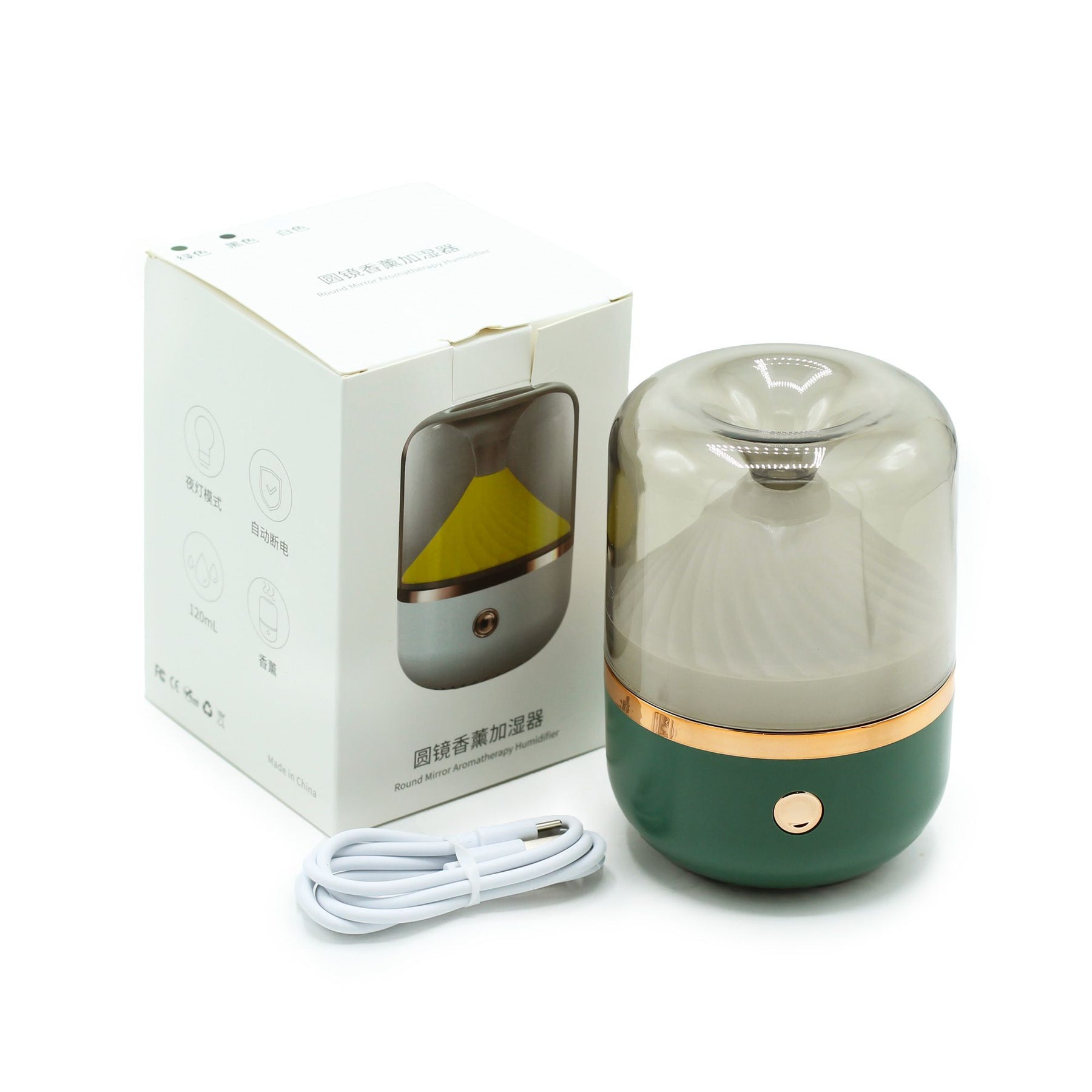 Sleek green & bronze urban aroma diffuser glowing with soft colour-changing light, fine mist rising, USB-C cable