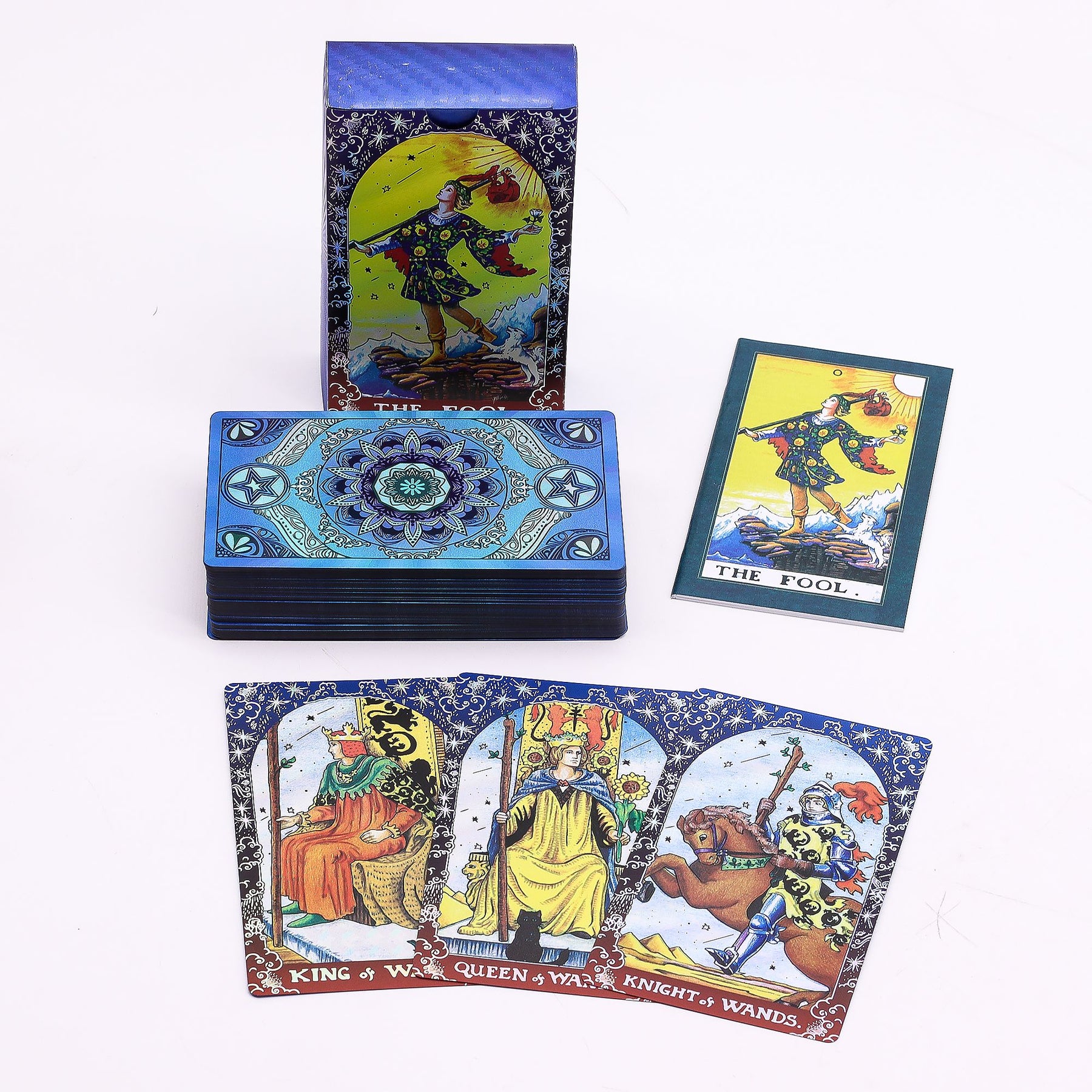 Blue foil Mandala Tarot Deck fanned out showing intricate gold mandala designs on deep blue cards, guidebook and box