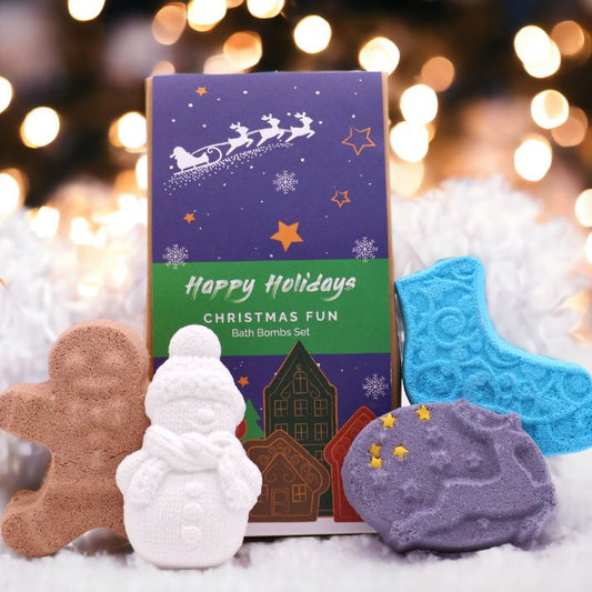 Christmas Fun bath bomb gift set with gingerbread man, ice skate, snowman and reindeer bath bombs individually wrapped in festive kraft box with red bow