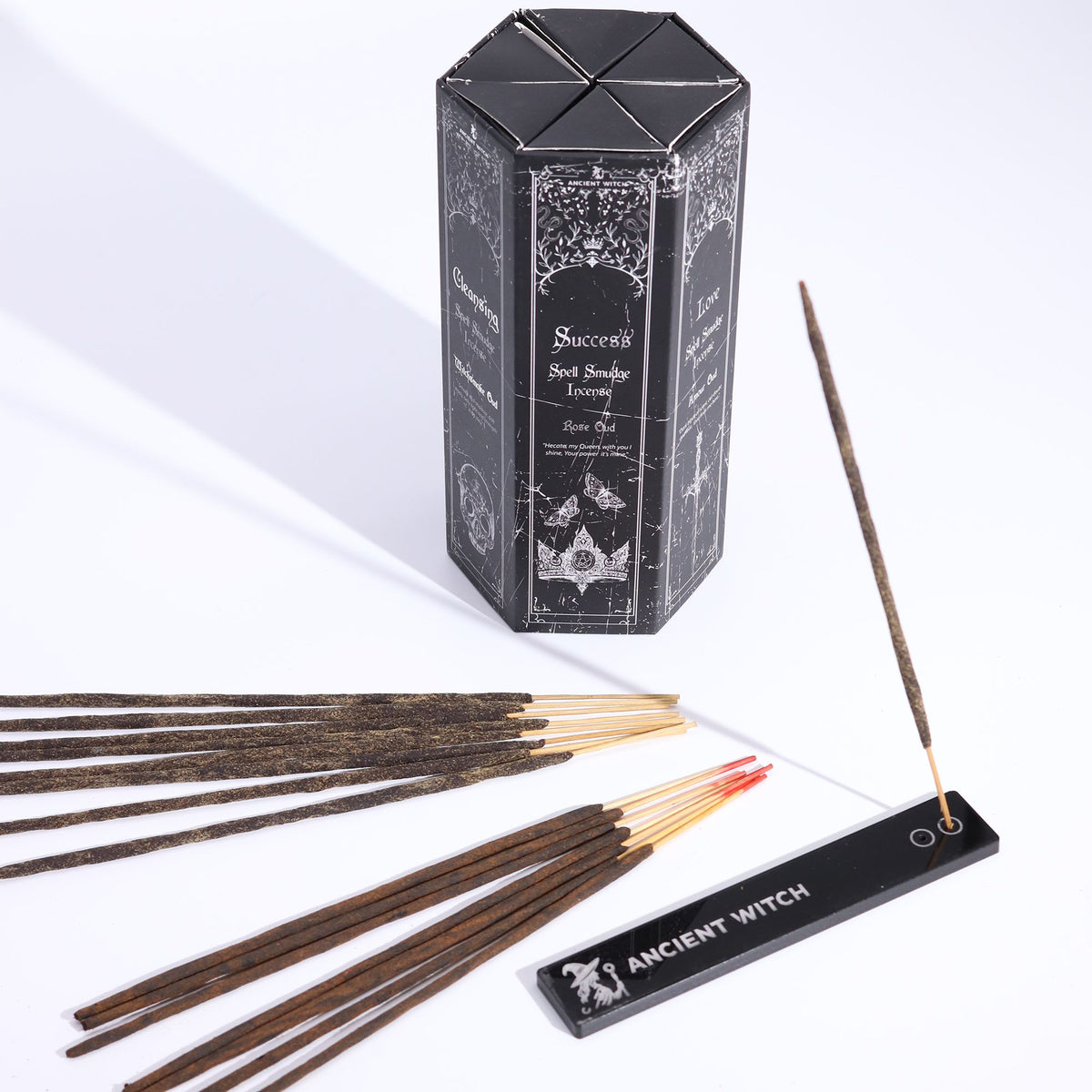 Incense sticks with a hexagonal box labeled 'Success' and incense holder on a white background