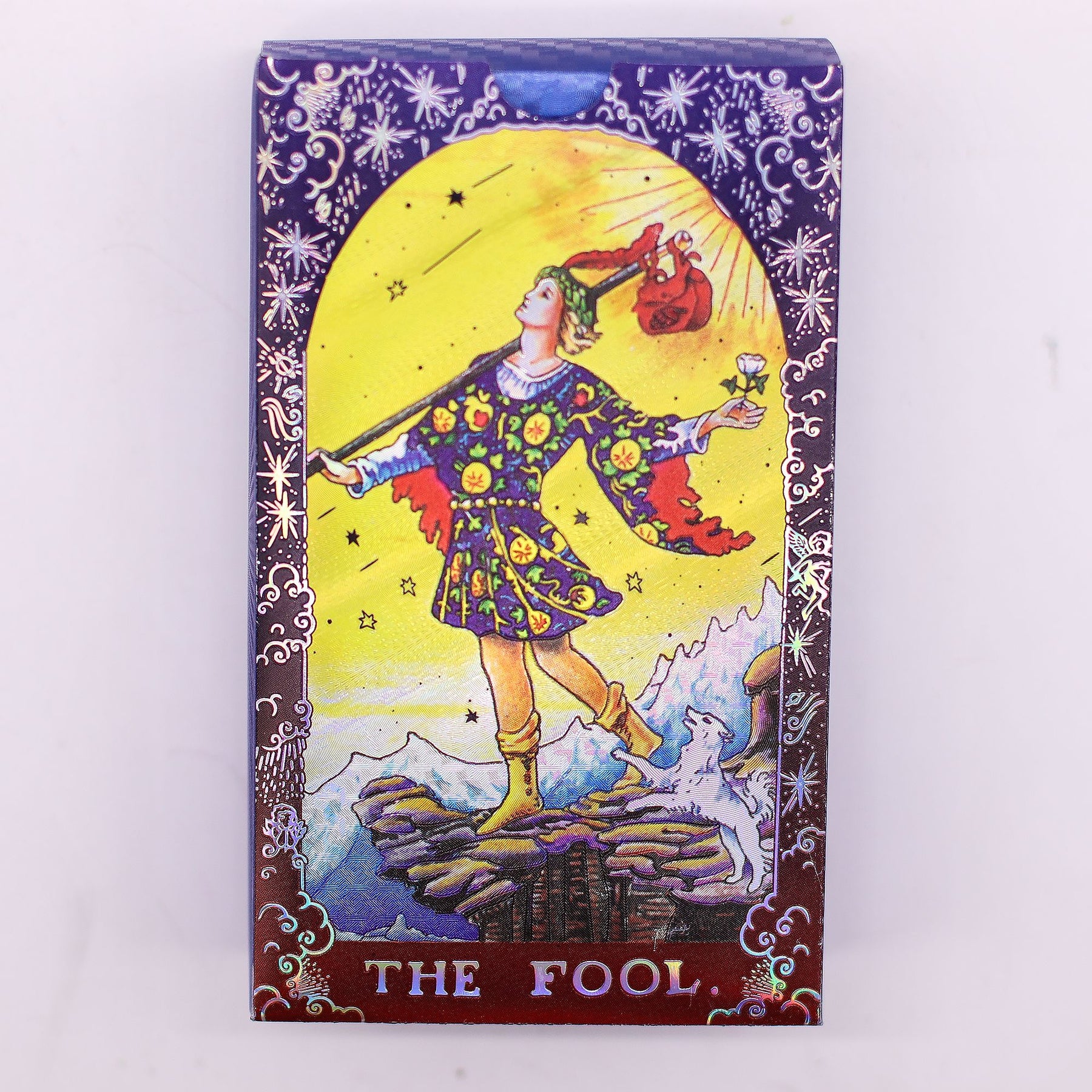 Card featuring 'The Fool' from a tarot deck with colorful illustration