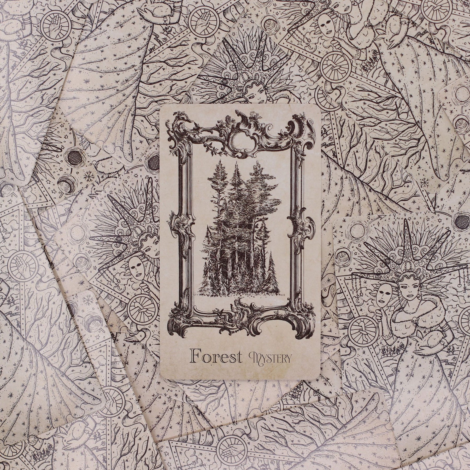 40-card Spellbook Oracle Deck fanned out showing monochrome sigils, creatures & artefacts, in illustrated compact box