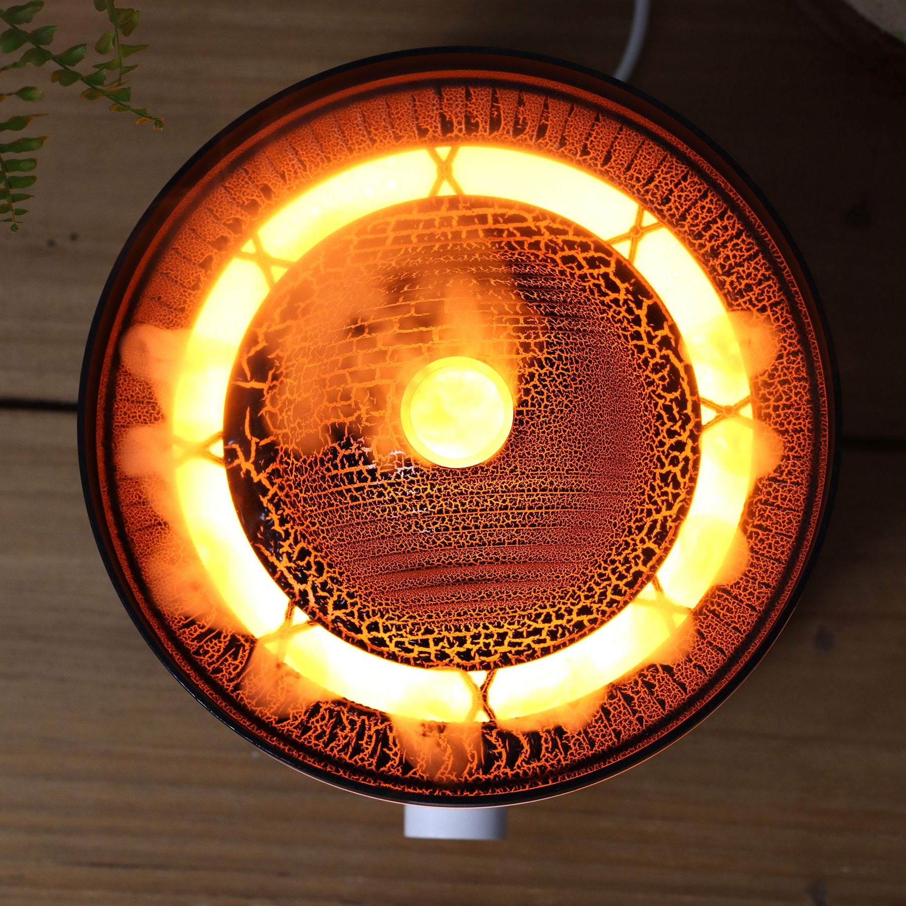 Large black volcano aroma diffuser erupting with swirling coloured mist and glowing LED ring