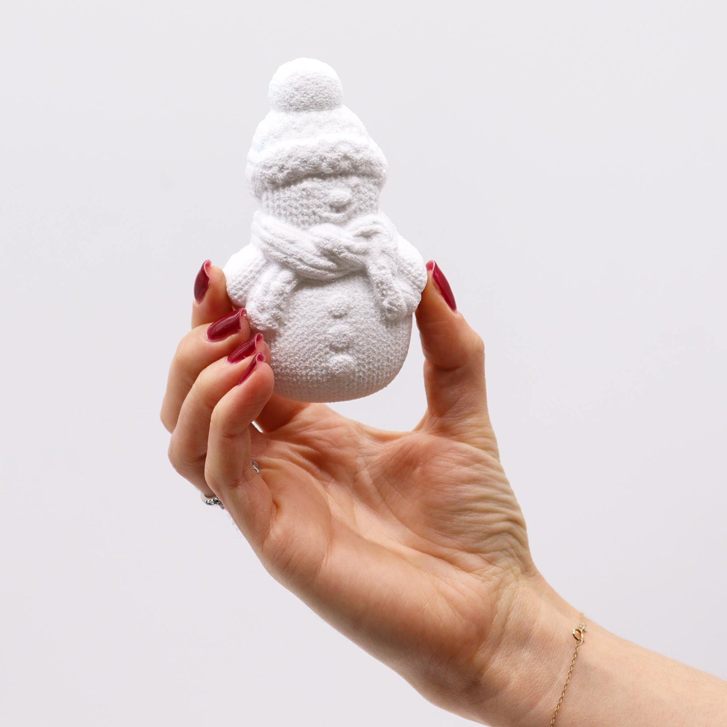 Christmas Fun bath bomb gift set with gingerbread man, ice skate, snowman and reindeer bath bombs individually wrapped in festive kraft box with red bow