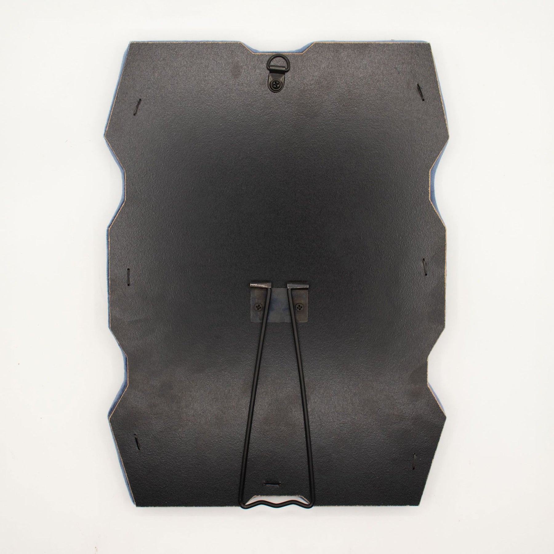Detail of built-in stand on back of mirror for tabletop use, sturdy MDF construction visible