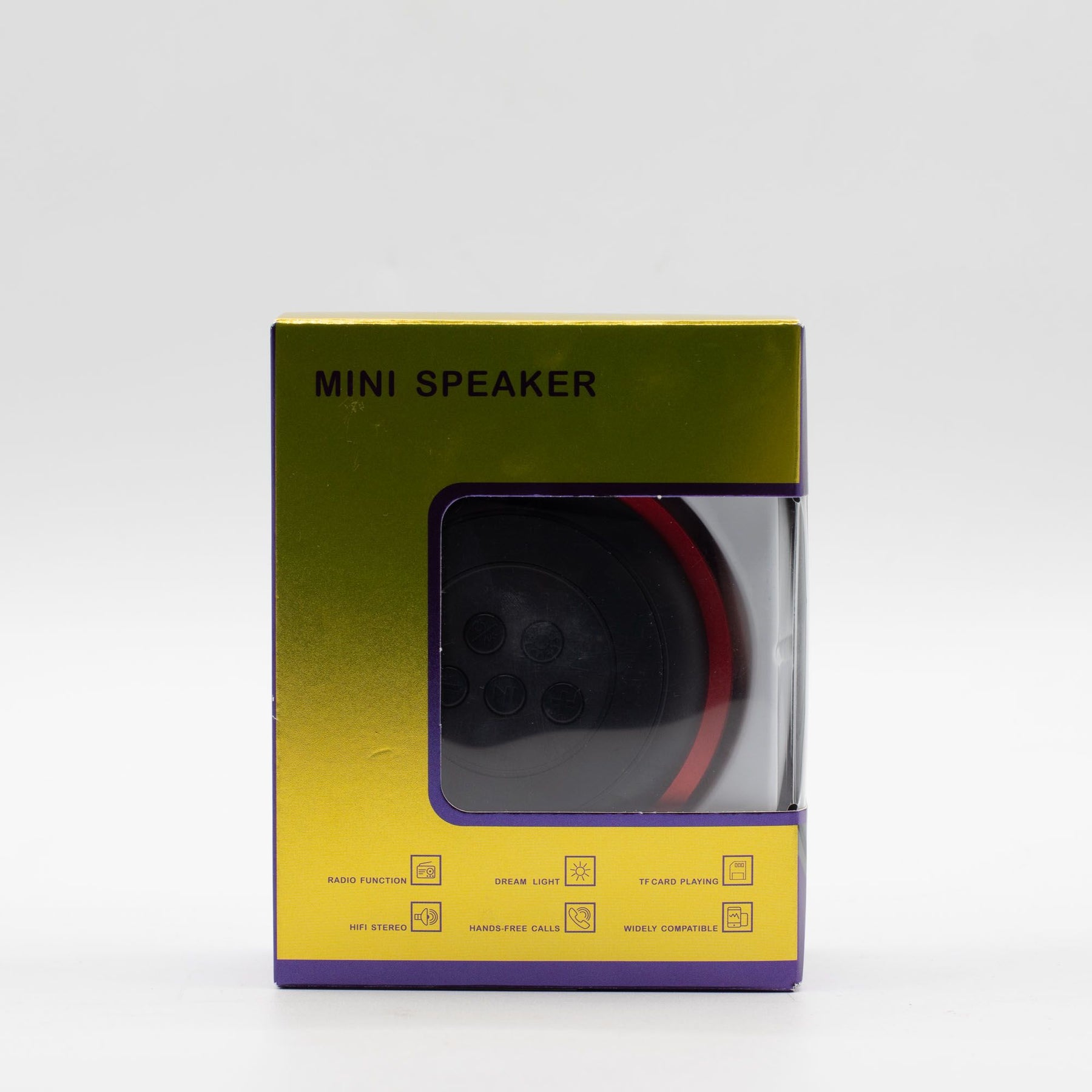 Mini speaker charging via USB cable, 600mAh battery indicator visible, travel-ready compact size