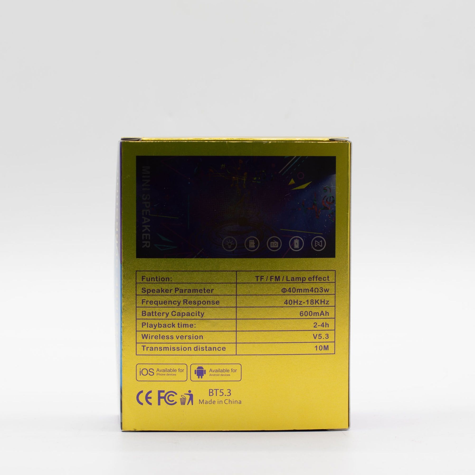 Mini speaker charging via USB cable, 600mAh battery indicator visible, travel-ready compact size