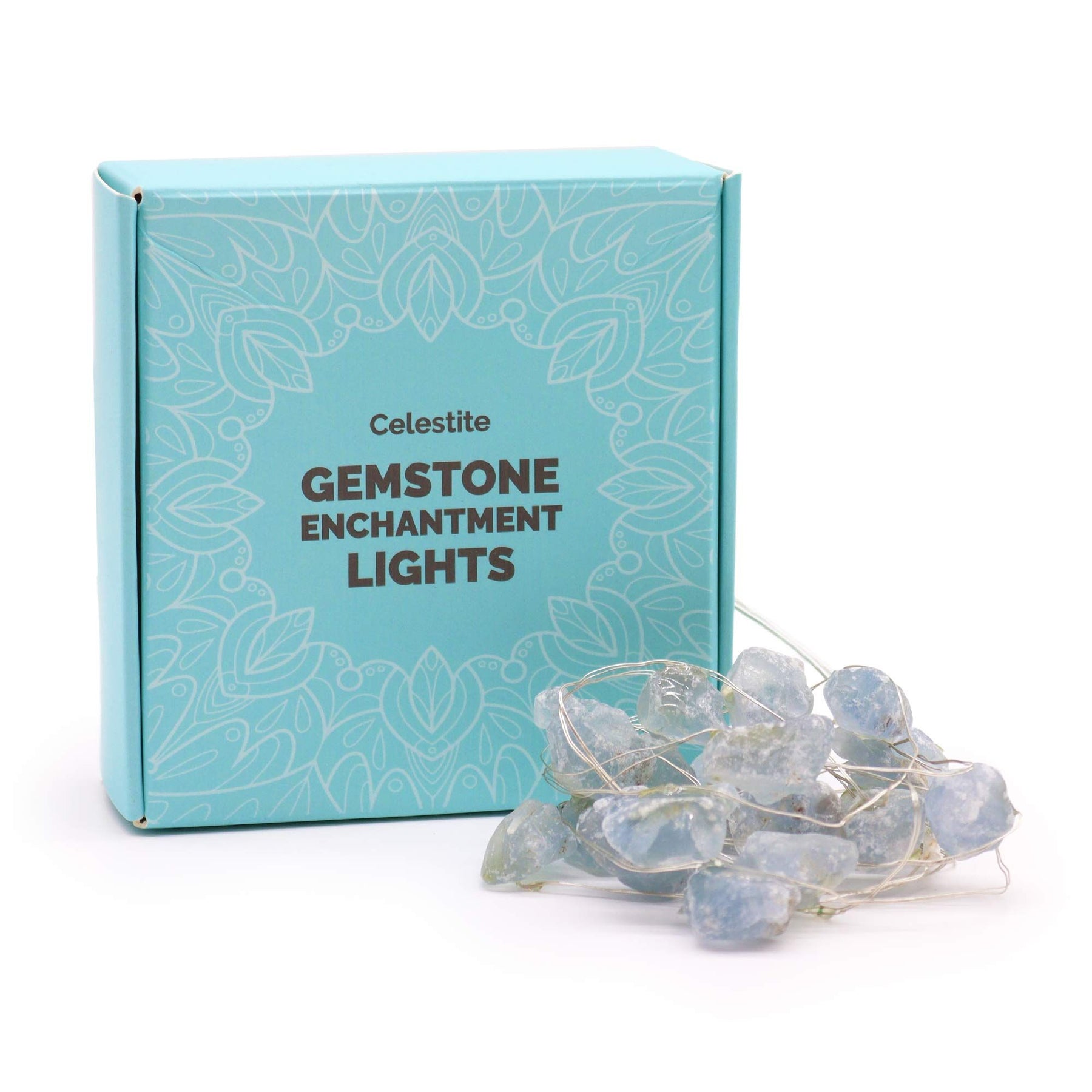Celestite crystal fairy lights glowing soft blue in a glass jar on bedside table with moon and stars in dreamy bedroom setting