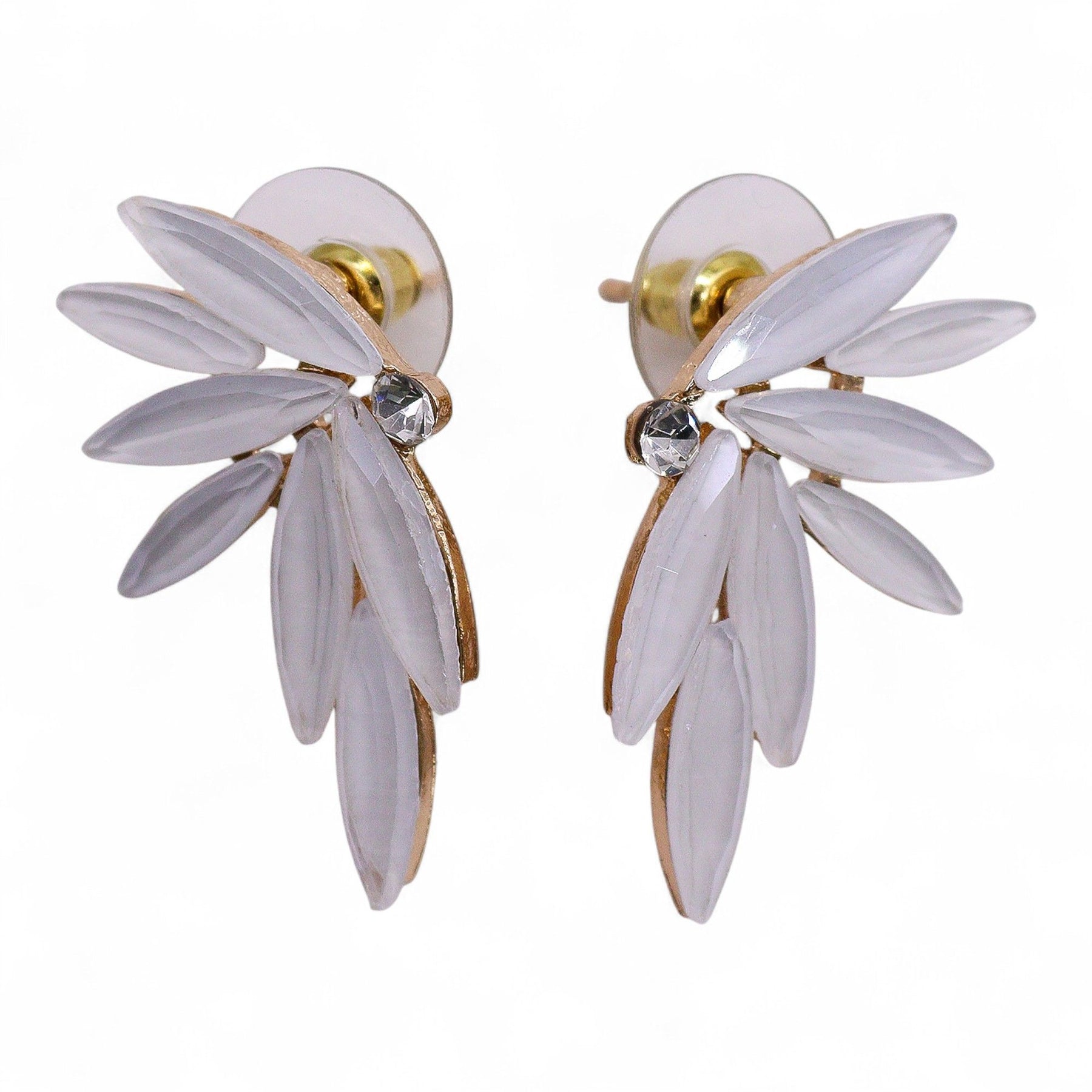 Pearl-white vintage glass fairy wing earrings catching soft dawn light, styled with white feathers and morning mist