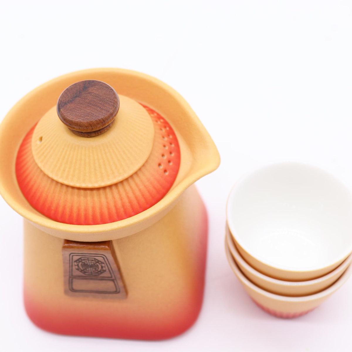 Temple Teapot Set with three cups in warm Orange Earth design