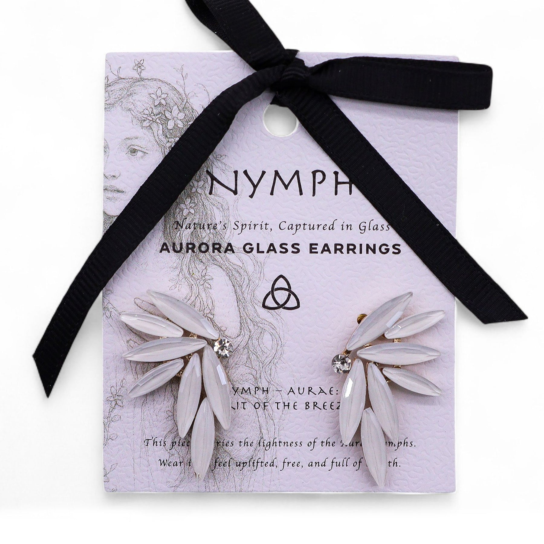 Pearl-white vintage glass fairy wing earrings catching soft dawn light, styled with white feathers and morning mist
