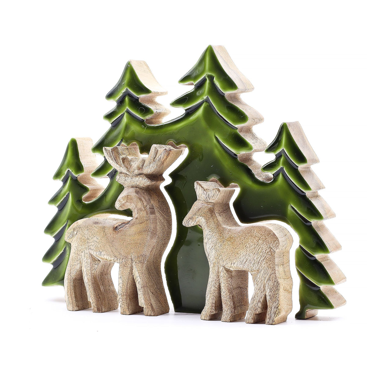 3D mango wood deer in forest decoration with two standing deer, green enamel trees and layered woodland scene on mantel with fairy lights and pine cones