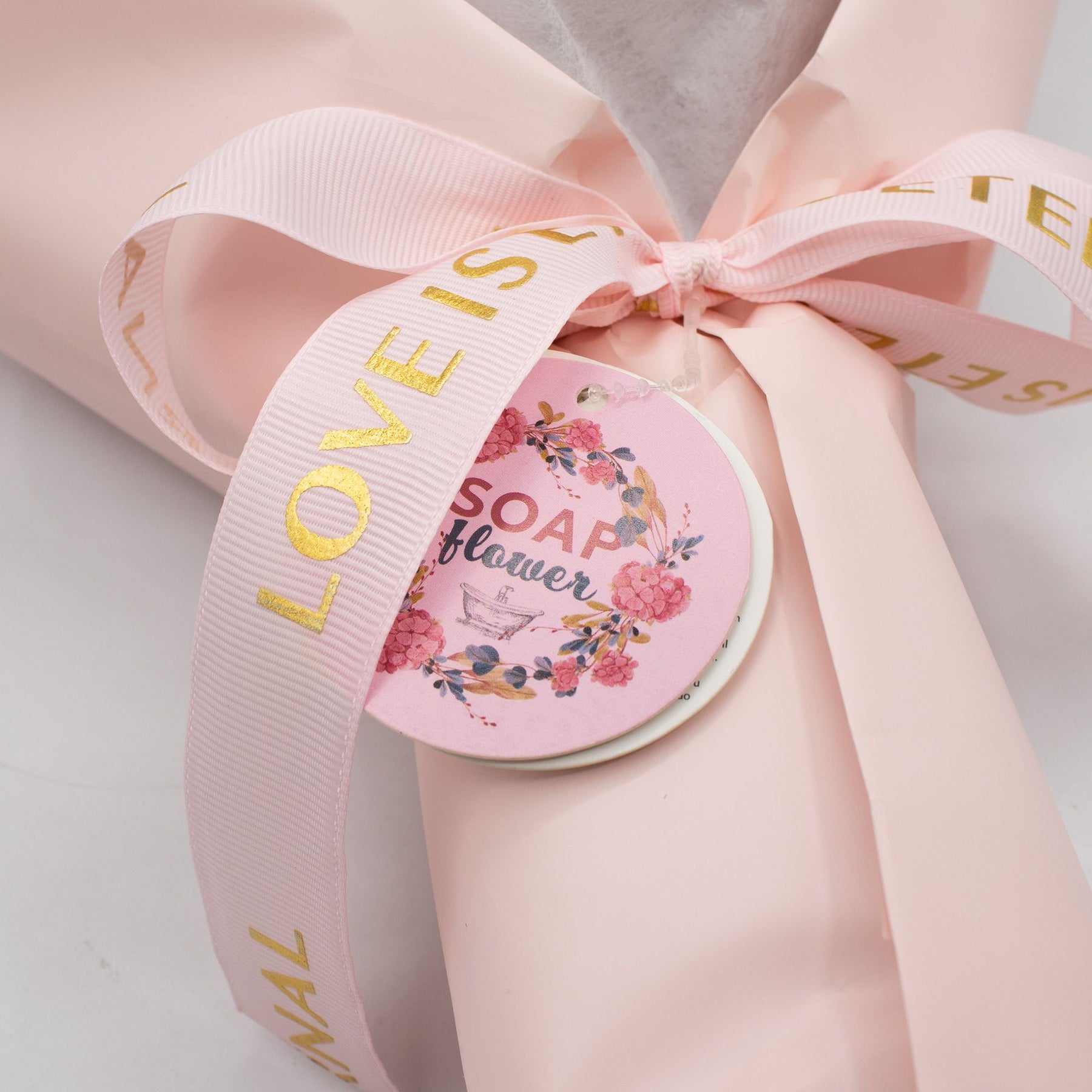 Soap rose bouquet placed beside open gift card with gold heart holder, ready for personal handwritten message