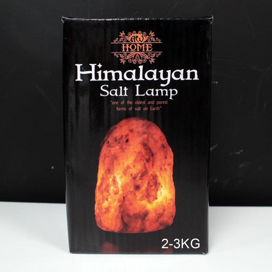 Large 2–3kg natural pink Himalayan salt lamp glowing richly on wooden base