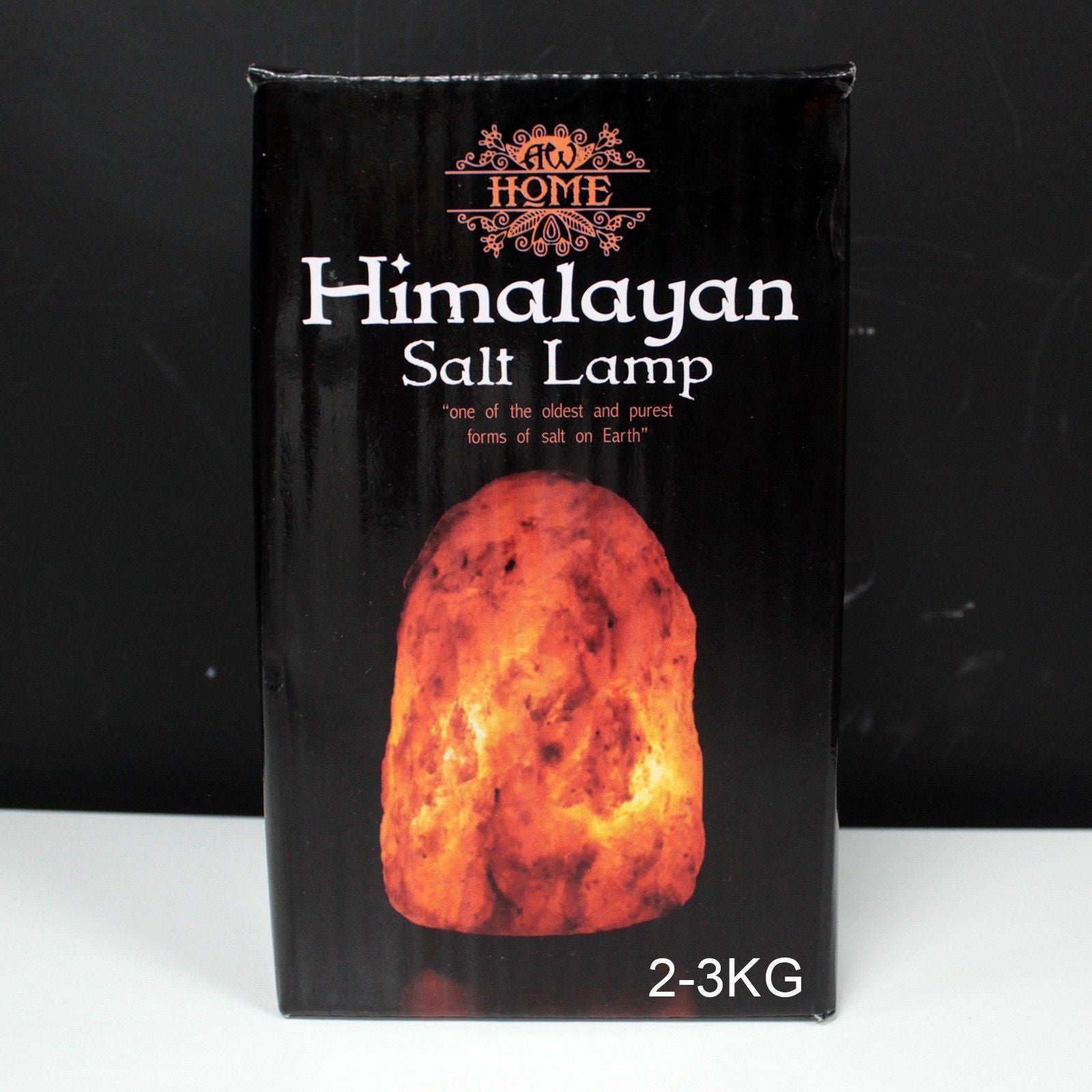 Large 2–3kg natural pink Himalayan salt lamp glowing richly on wooden base