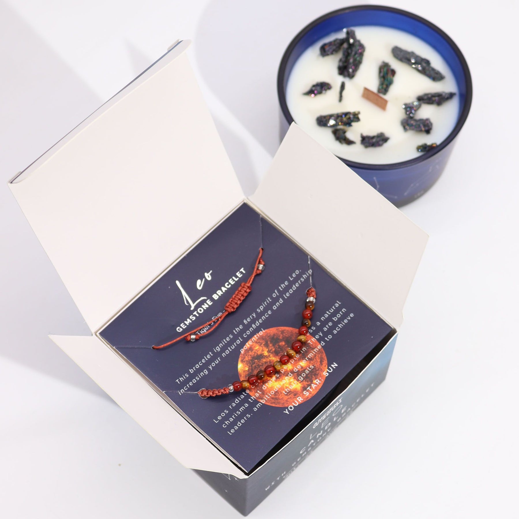 Bracelets in a box with a candle in the background