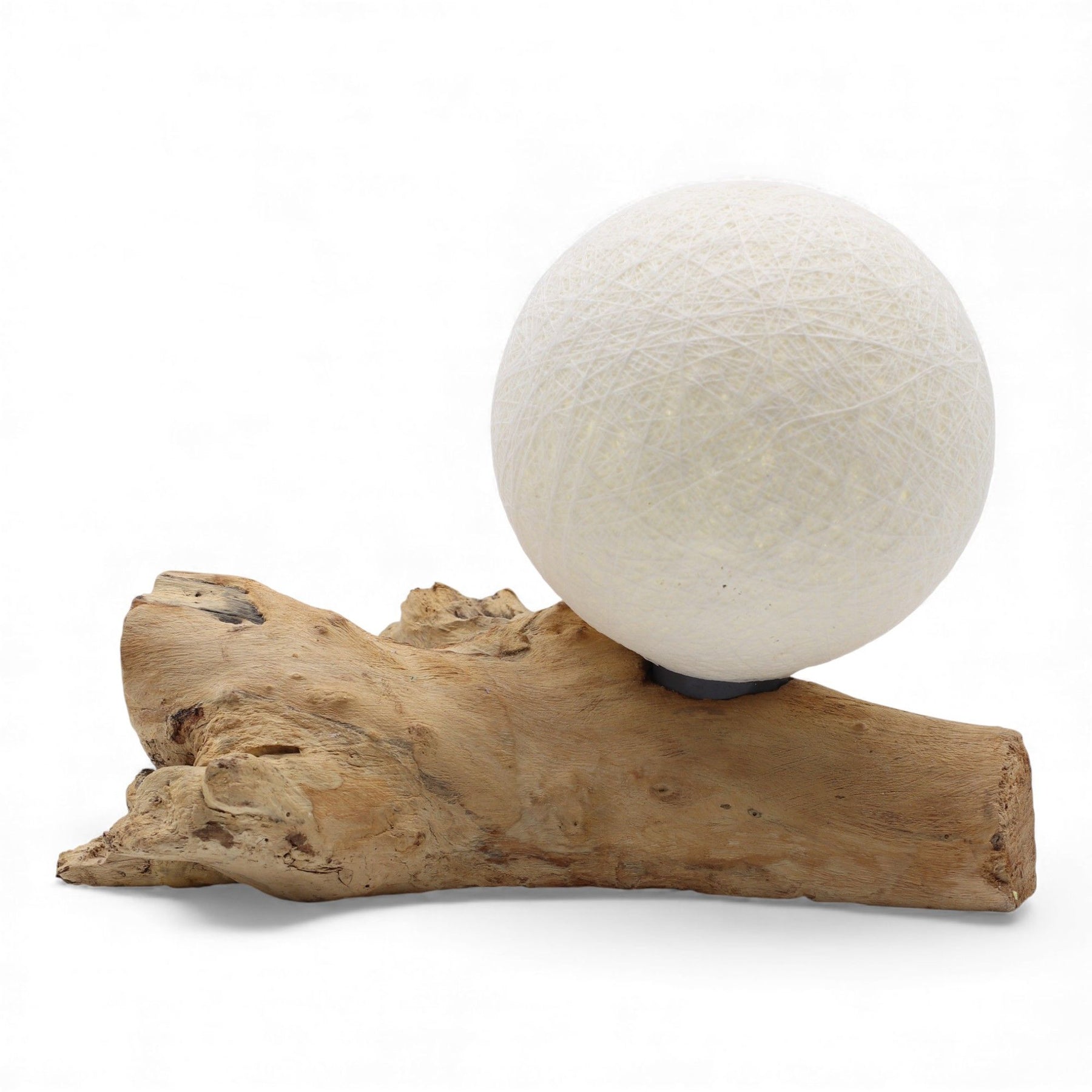 Ivory cotton-wrapped Luna sphere glowing like a full moon atop twisted driftwood base