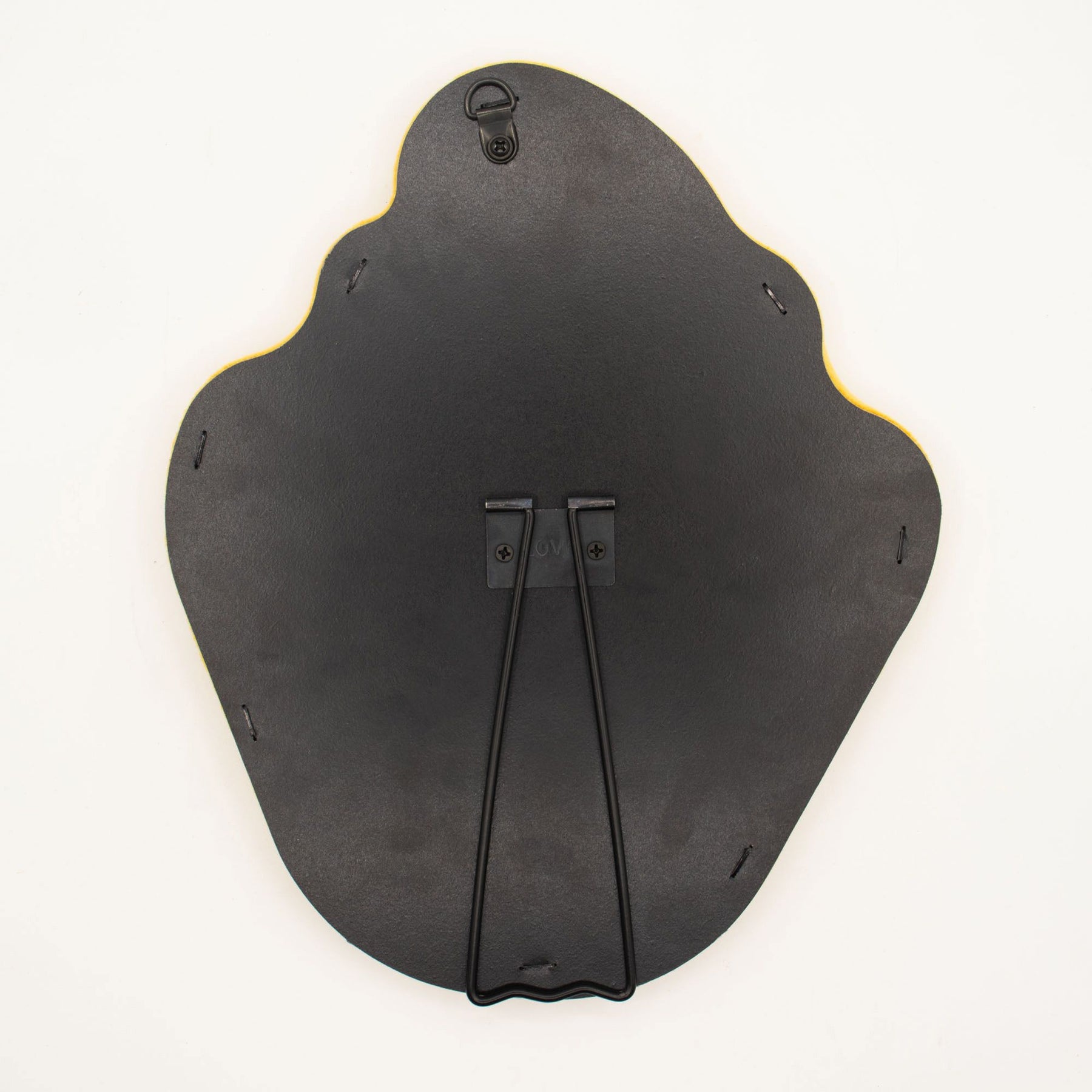 Detail of built-in stand on back of mirror for tabletop use, sturdy MDF construction visible