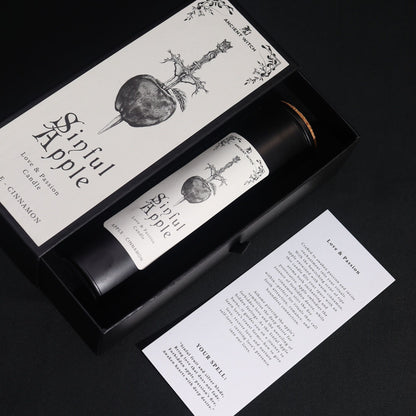 Candle set with packaging and a card on a black background