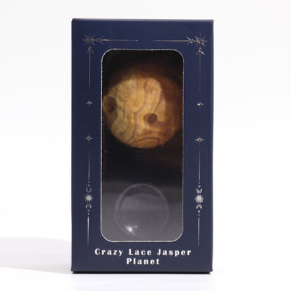 40mm swirling Crazy Lace Jasper Mercury sphere floating on shimmering goldstone ring stand, glowing against starry cosmic background