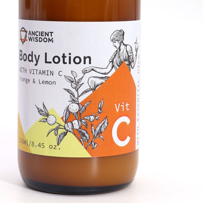 Amber pump bottle of Vitamin C Goddess’s Body Lotion bottle with 'Ancient Wisdom' label on a white background