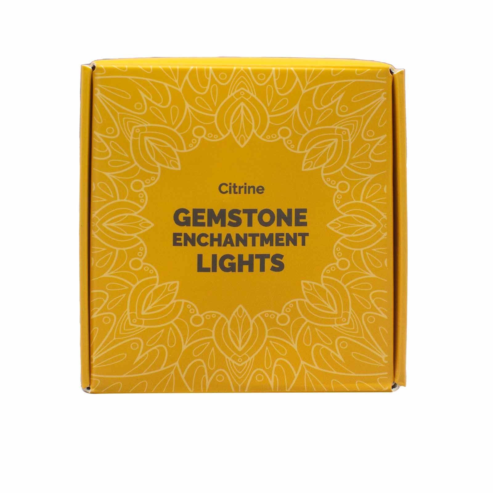 Yellow box with 'Citrine Gemstone Enchantment Lights' text and decorative patterns on a white background