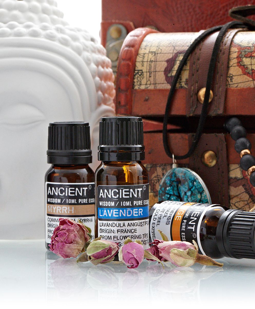 10ml amber glass bottle of pure Lavender Essential Oil with black dropper cap, fresh lavender sprigs