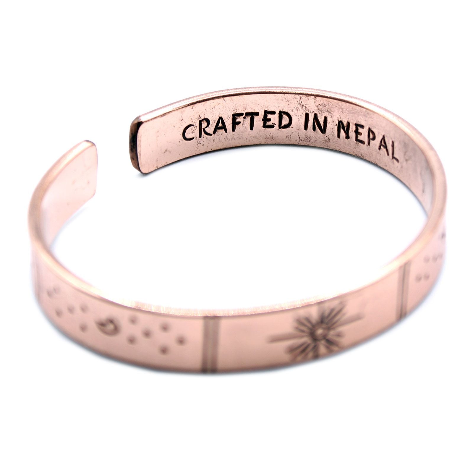 Hand-hammered brass galaxy cuff from Nepal with secret inner mantra (Dream Big, Reach For The Stars & more). Stars & Earth design outside. Fair-trade, adjustable, gift-ready with story card