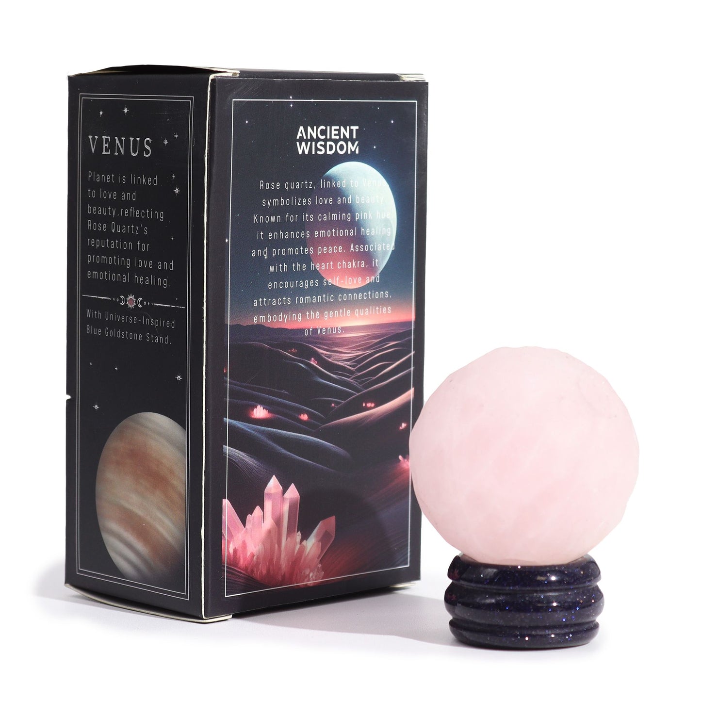 Soft pink 40mm Rose Quartz Venus sphere glowing on glittering goldstone ring stand, surrounded by rose petals and candles in romantic setting