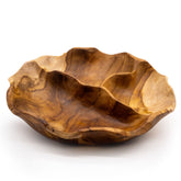 Smooth round teakwood fruit bowl with three divided sections, rich natural grain visible