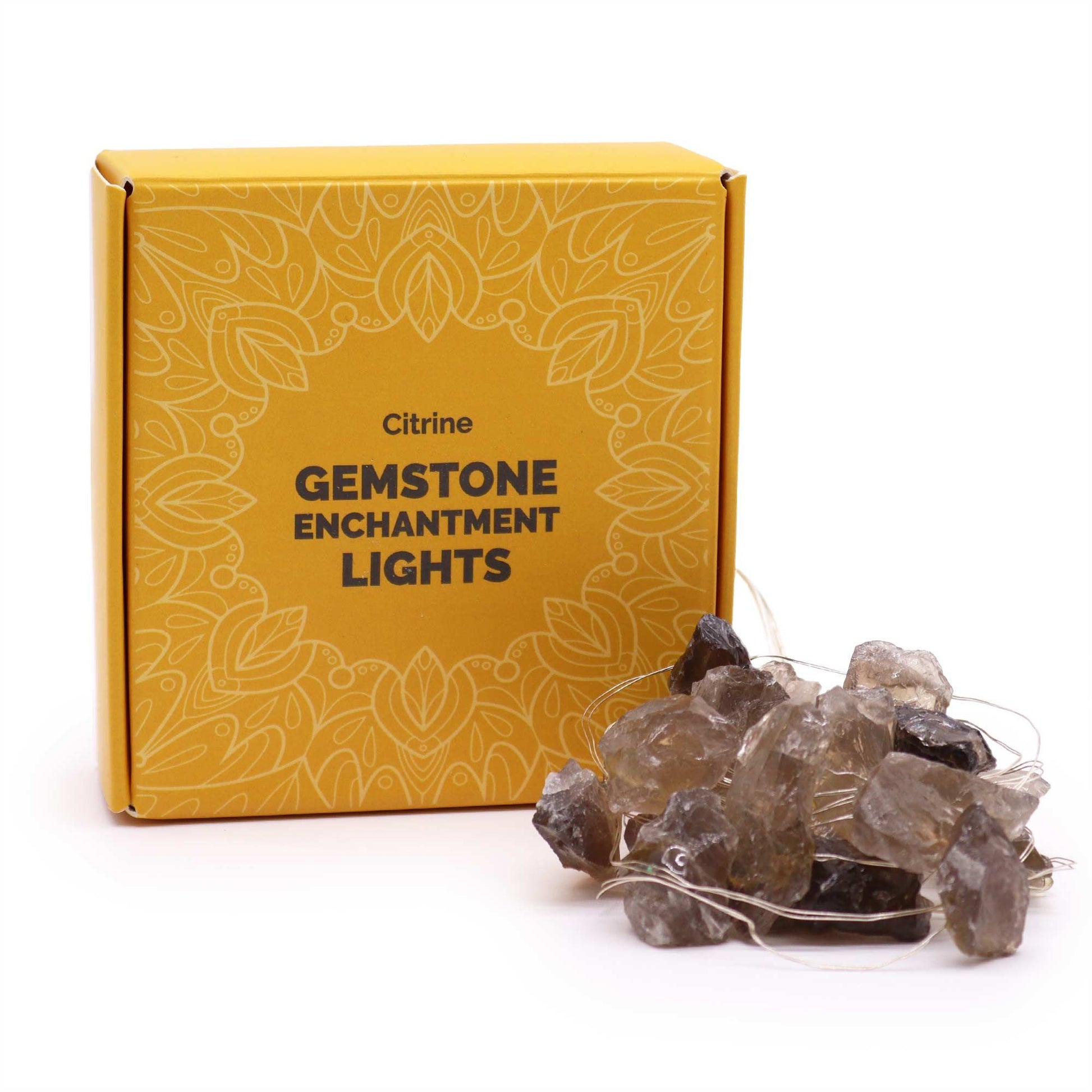 Citrine Gemstone Enchantment Lights with warm golden-yellow glowing bulbs on 227cm string, draped decoratively around crystals and plants, creating uplifting ambient light