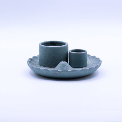 Ceramic candle holder with two cups on a matching base