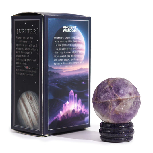 Rich purple 40mm Amethyst Jupiter sphere floating on glittering goldstone ring stand, regal cosmic background with soft golden light