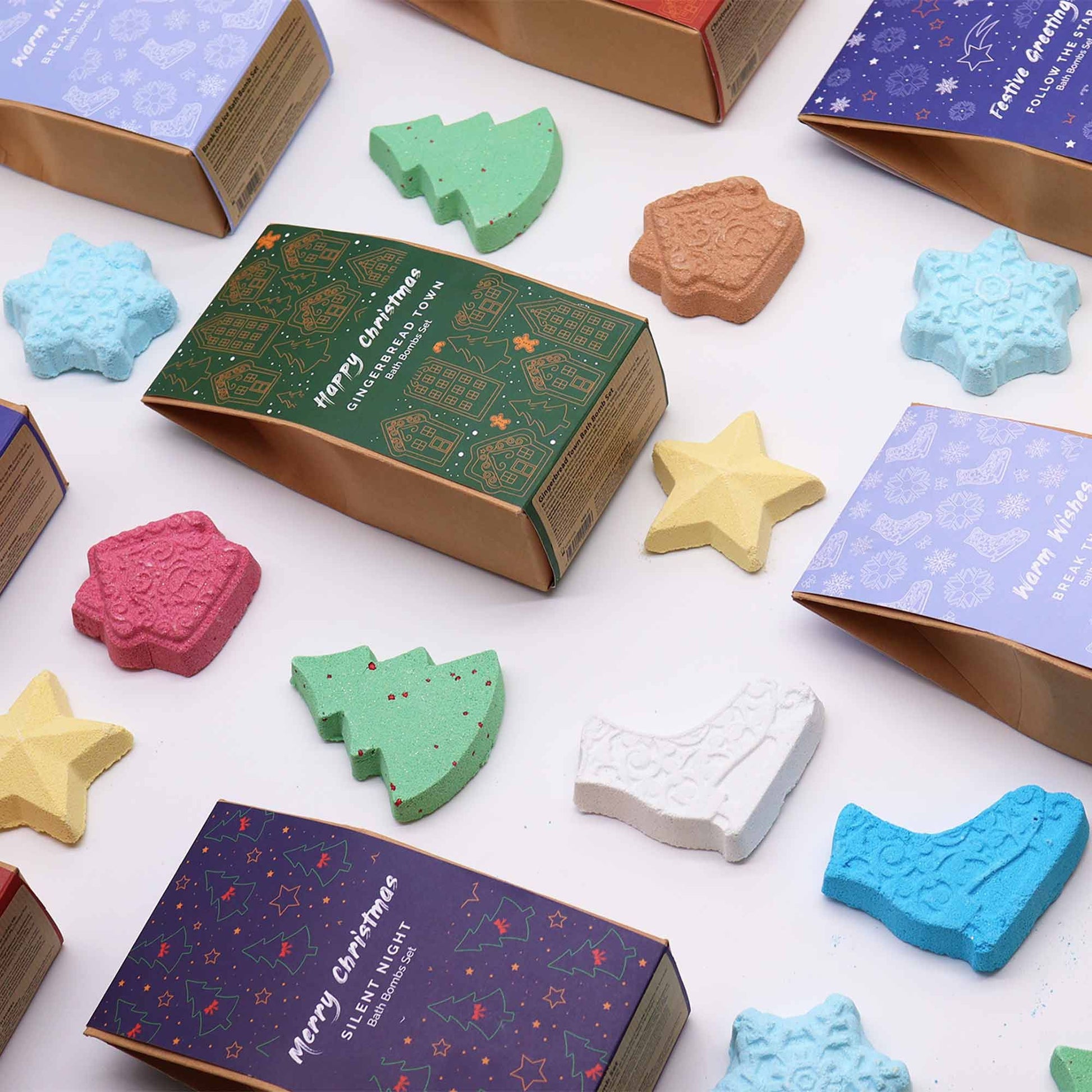 Colorful Christmas-themed bath bombs with decorative boxes