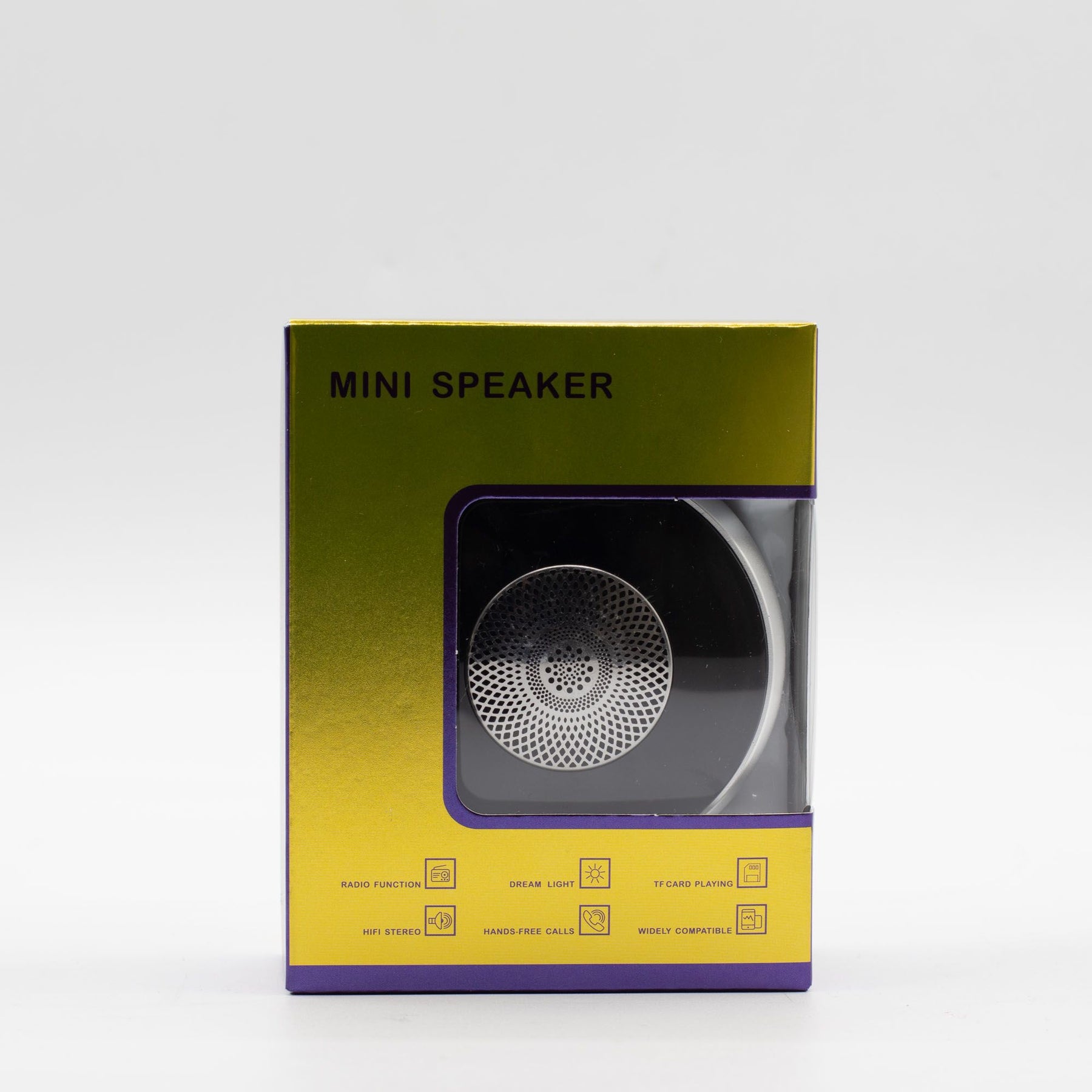 Mini speaker charging via USB cable, 600mAh battery indicator visible, travel-ready size