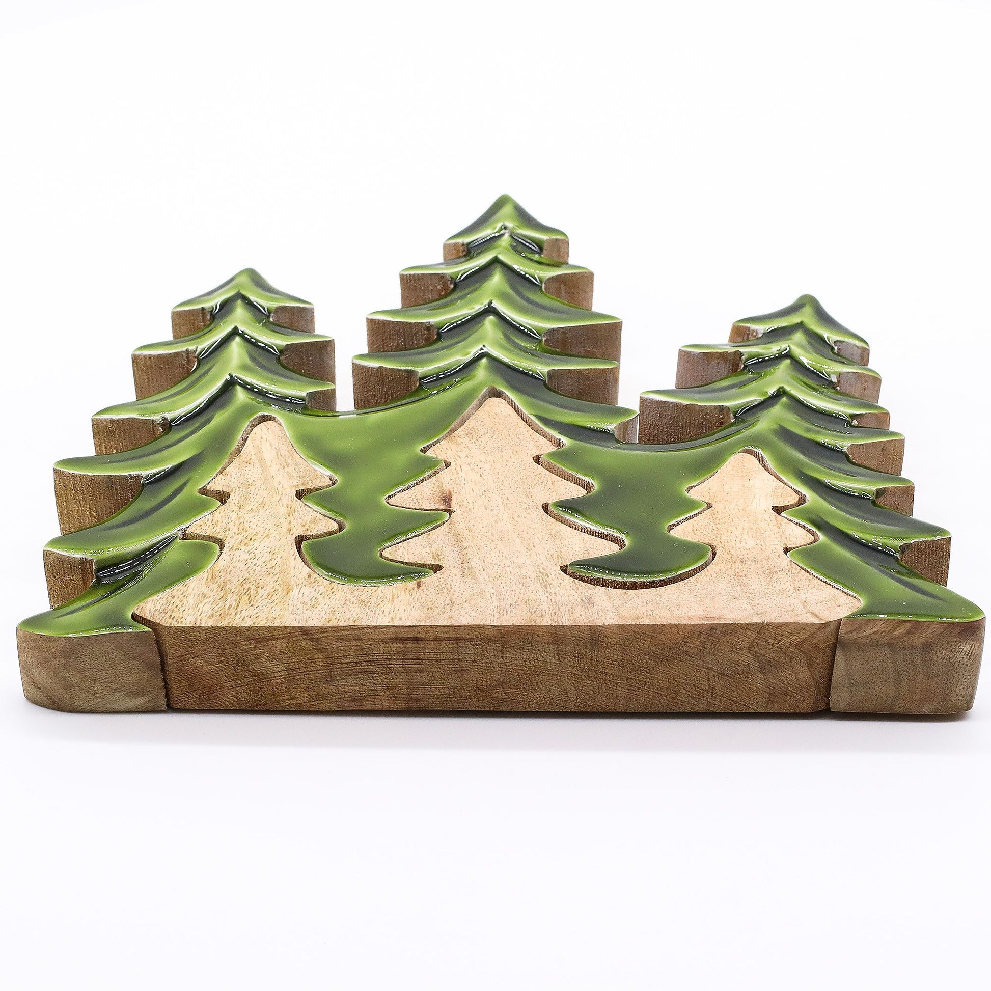 20×23cm 3D mango wood three pine trees decoration with deep green enamel branches on wooden base, styled on winter mantel with fairy lights and snow