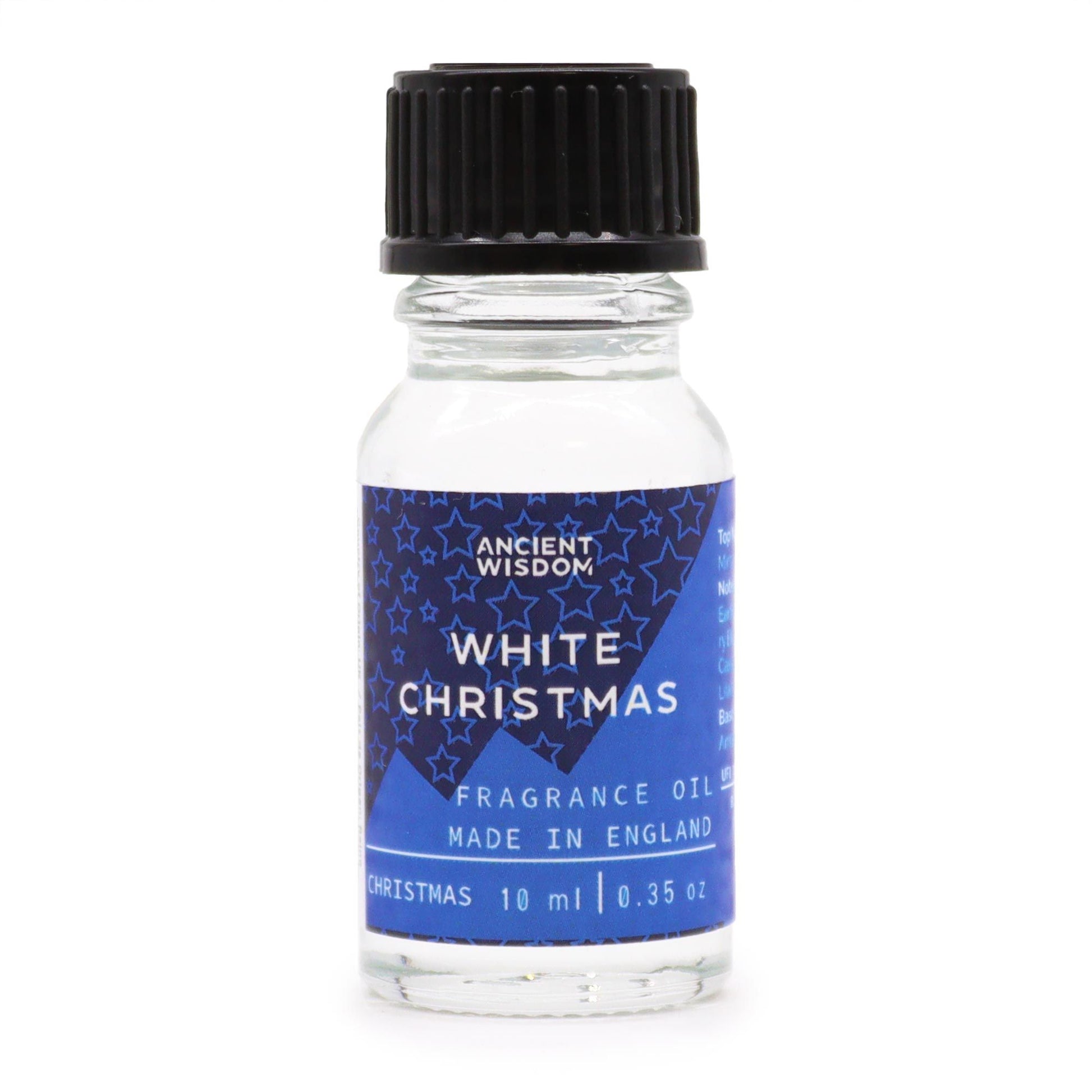 10ml White Christmas fragrance oil bottle surrounded by frosted pine, snowflakes and glittering snow on dark winter background