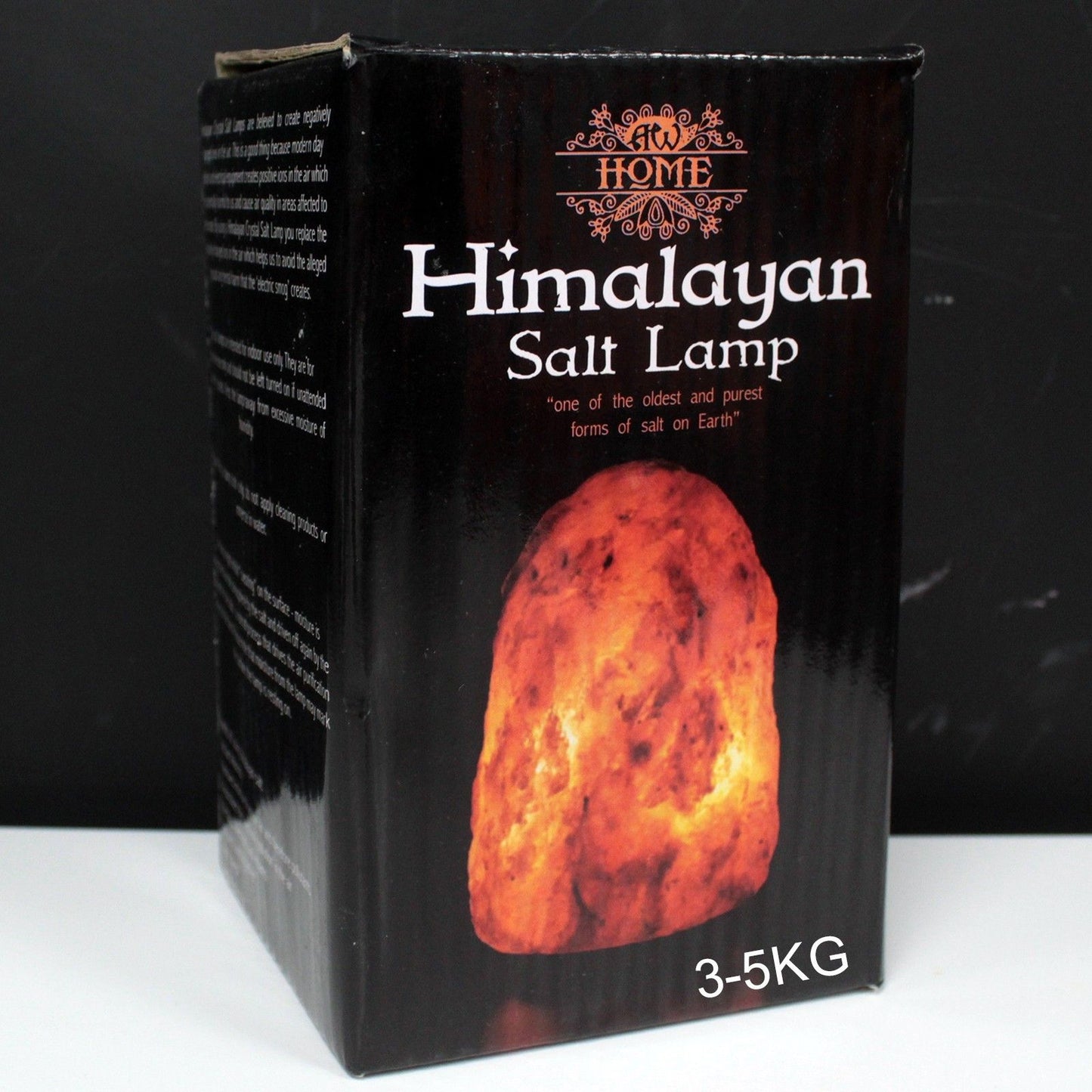 Large 3–5kg natural pink Himalayan salt lamp glowing richly on wooden base