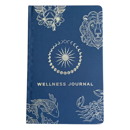 Deep midnight blue wellness journal with silver foil zodiac constellations, open to colourful mood wheel page