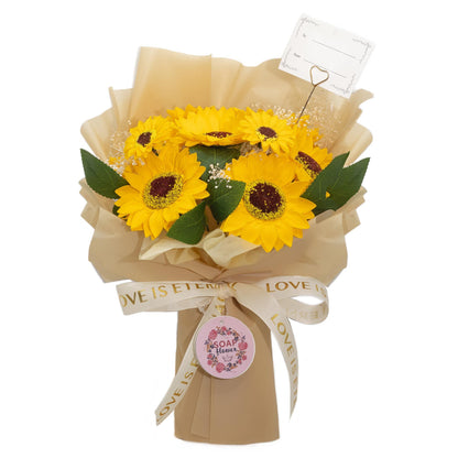 Large vibrant sunflower bouquet crafted from soap petals in golden wrapping with "Love is Eternal" ribbon