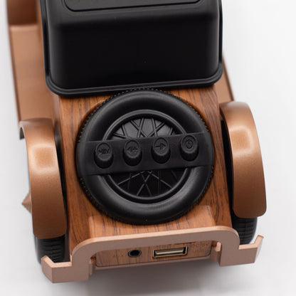 Detail of wood-effect finish, chrome accents and buttons for play/pause, volume & mode switch