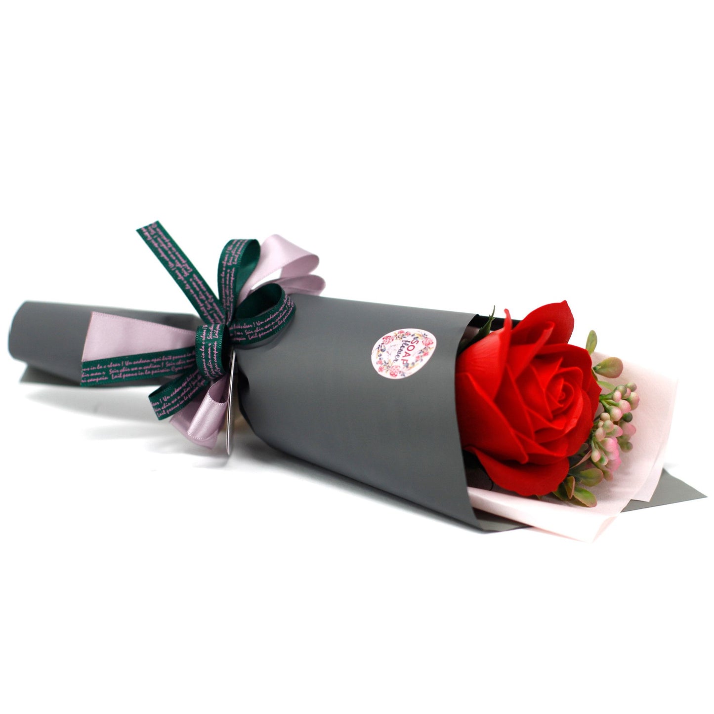 Bouquet of red roses wrapped in gray paper with a decorative bow