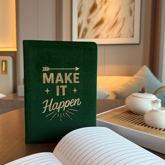 Deep green velvet notebook with gleaming silver “Make It Happen” script